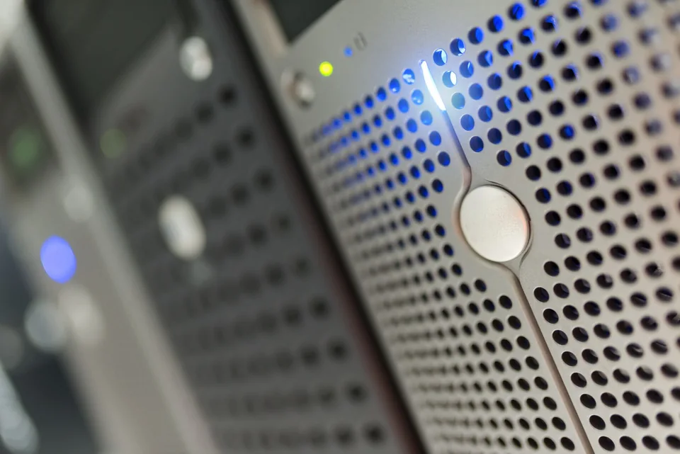 Close-up of server hardware with blue indicator lights.