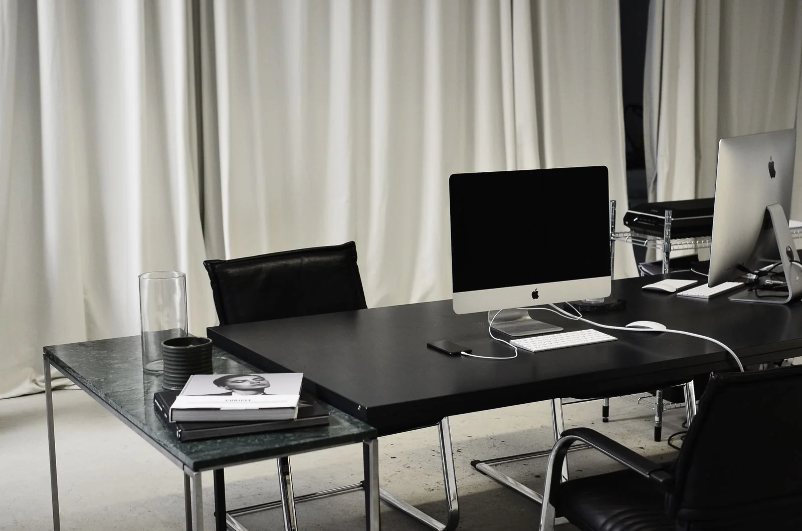 Desktop workstations with monitors, keyboards and mice.